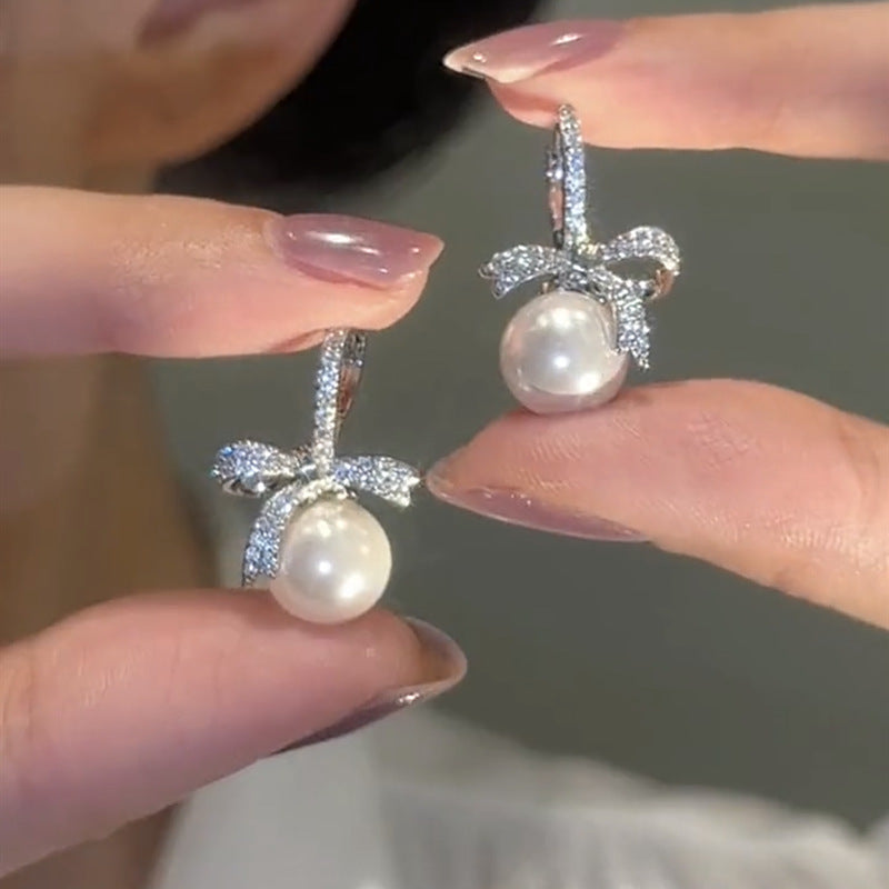Zirconia bow pearl earrings