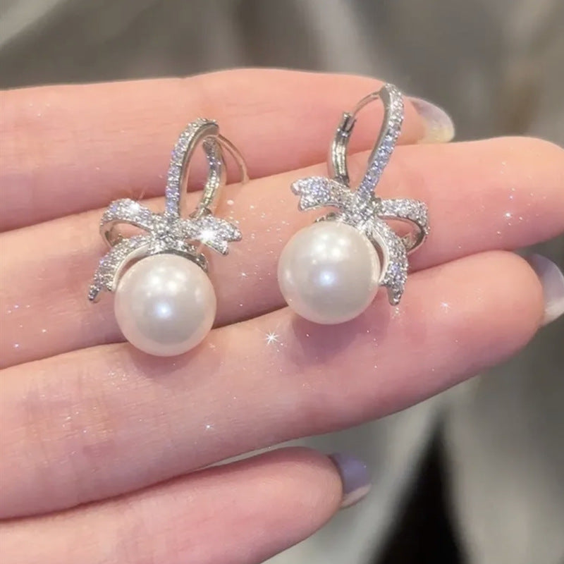 Zirconia bow pearl earrings