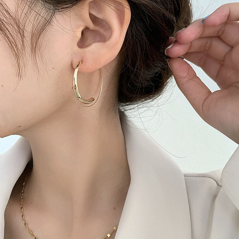 Large curved earrings