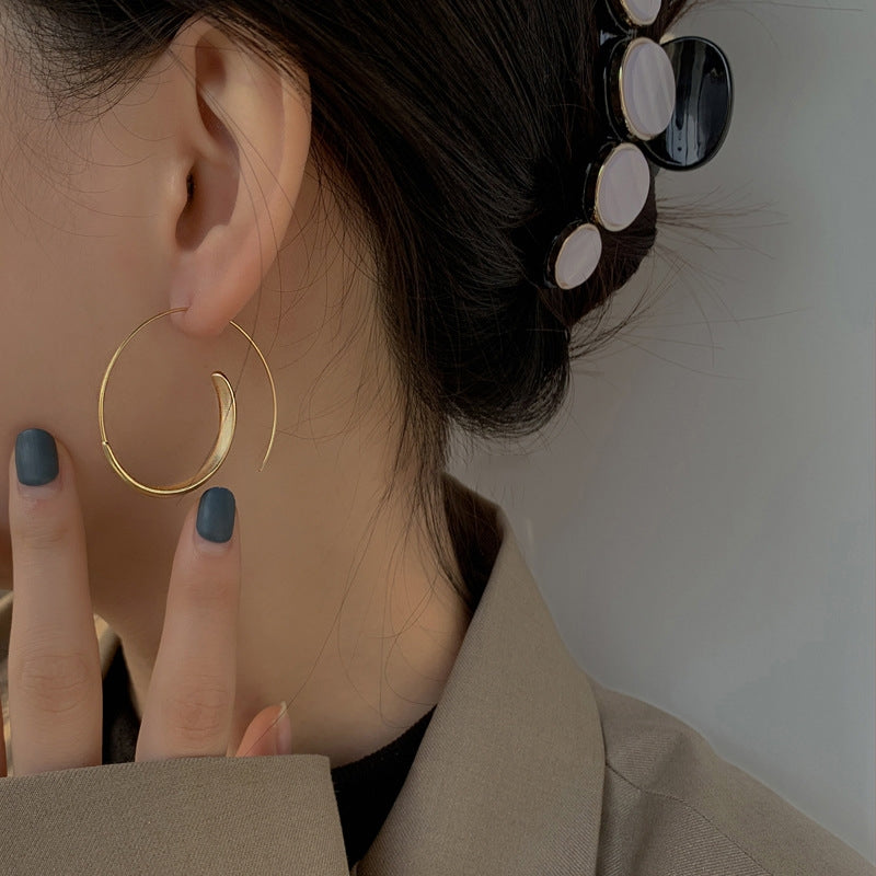 Large curved earrings