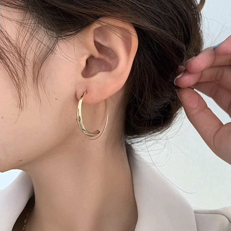 Large curved earrings