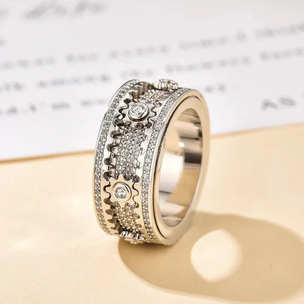 Pair relaxation ring - Fully set with diamonds, rotating gear design