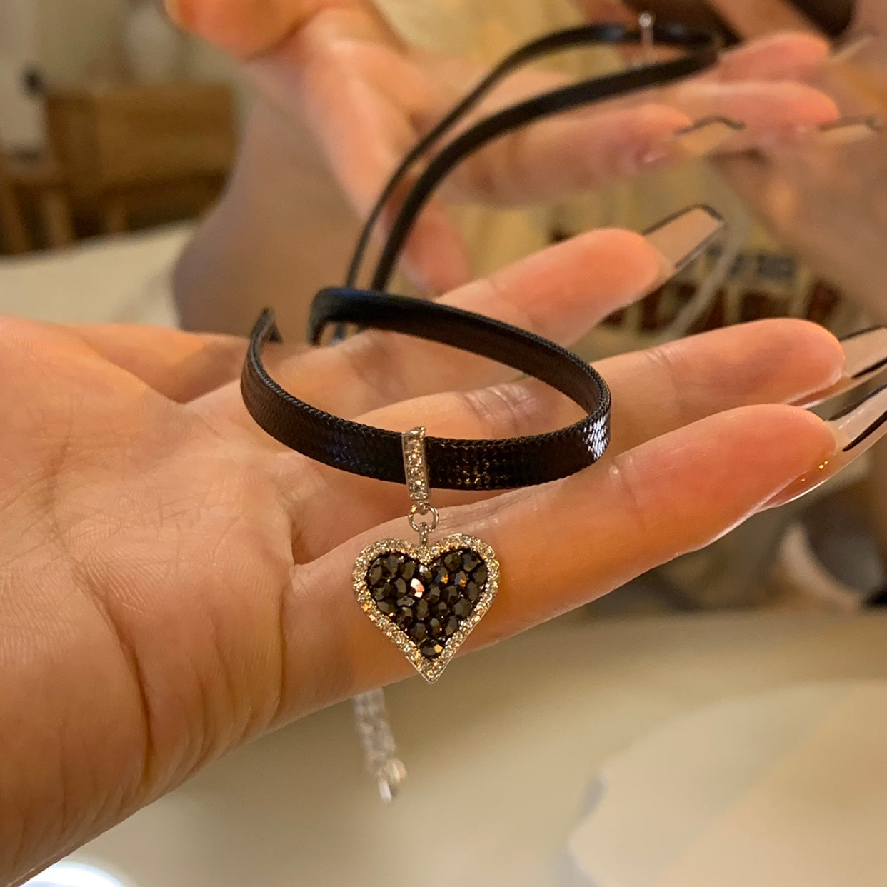 Black heart earrings with sparkling diamonds