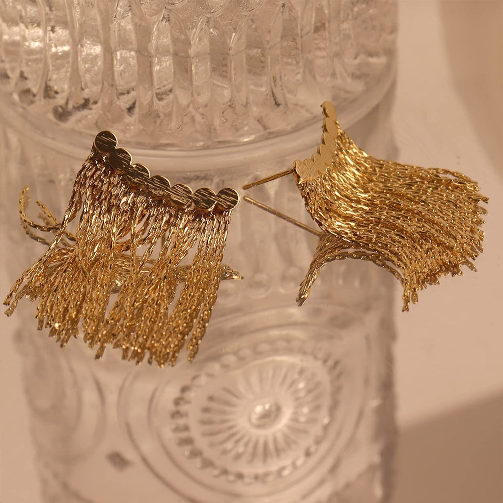 Long earrings with curved bar and tassel