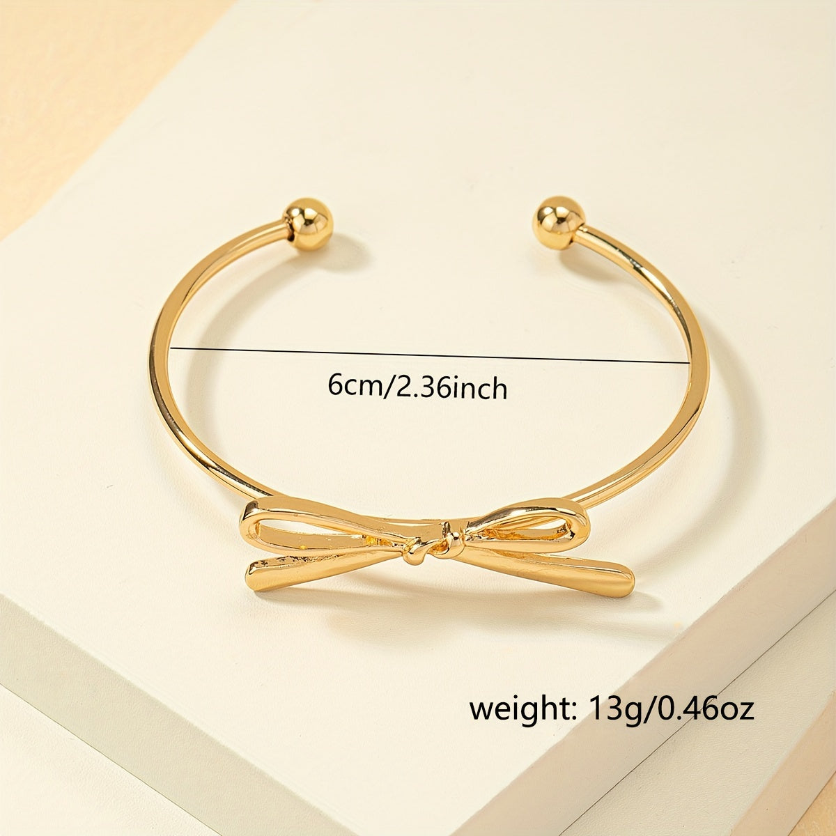 Vintage-Inspired Open Bangle – Delicate Bow Accent